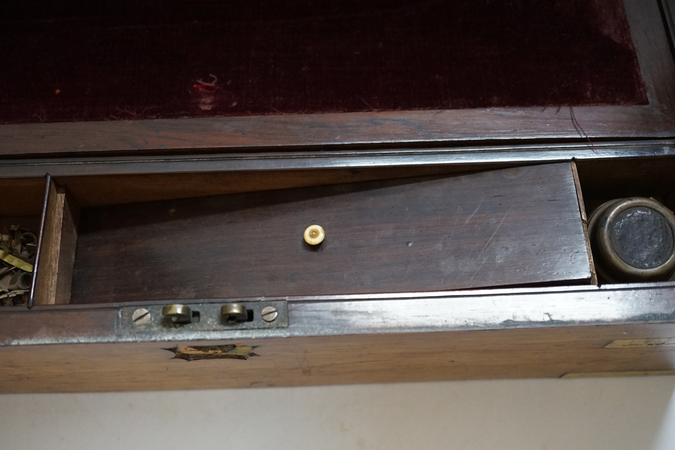 A Victorian rosewood brass bound writing slope, 40cm wide x 15cm high